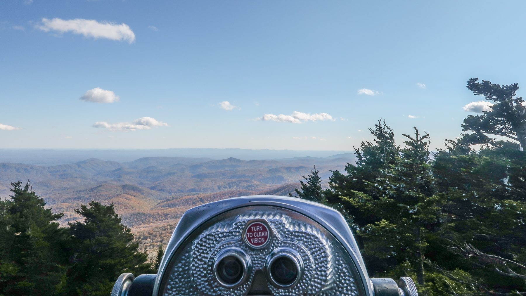 Magnifying viewfinder looking out at rolling mountains.